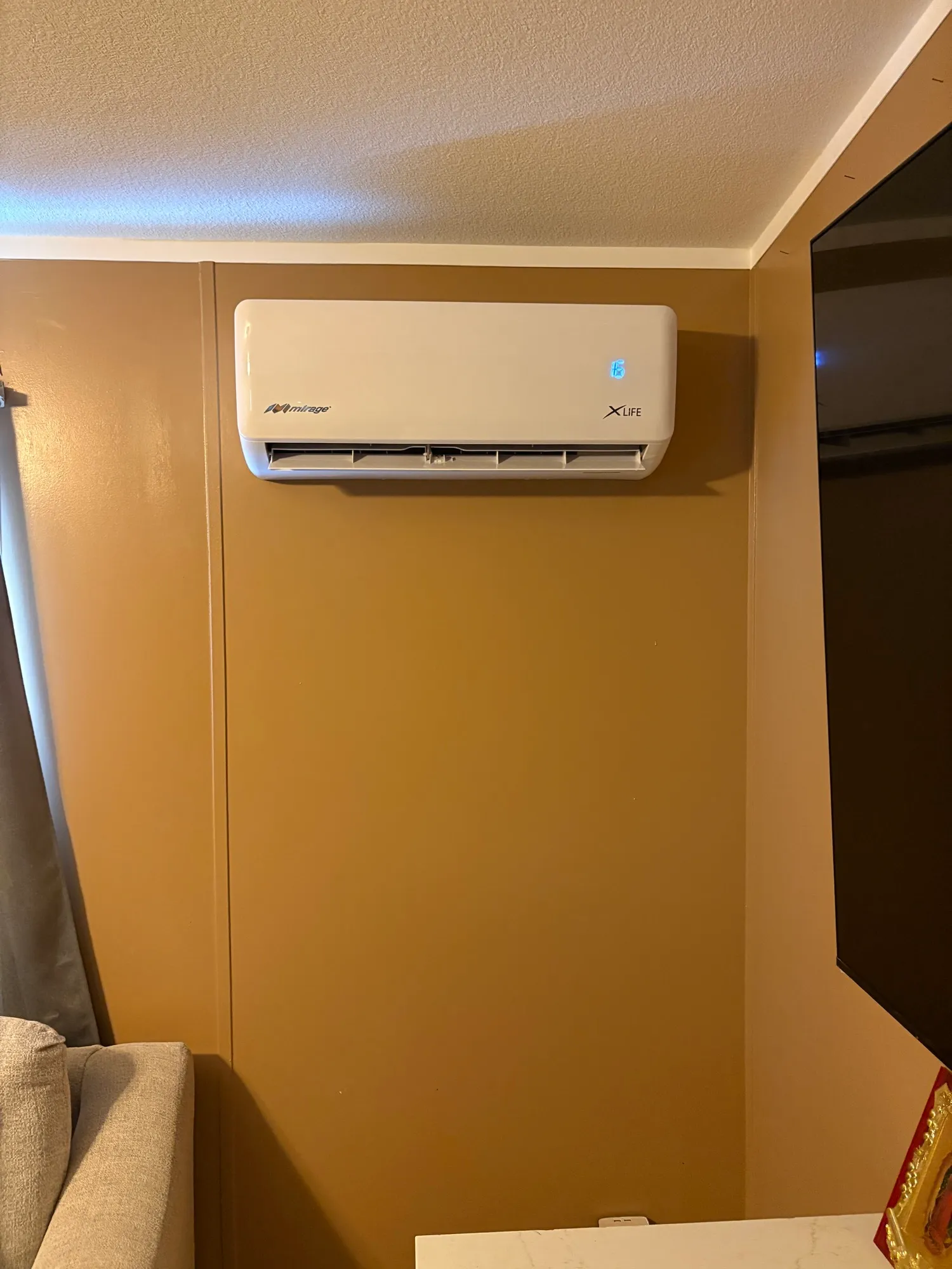 Wall-mounted Mirage mini split installed by Abundant Air, La Quinta CA